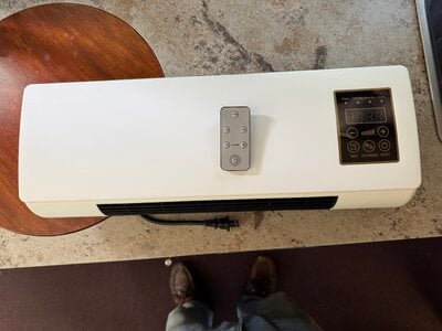 Wall mounted heat and air with remote.JPG