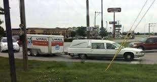 hearse pulling Uhaul.jpg